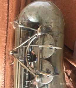 close up of keys on a saxophone before repair.