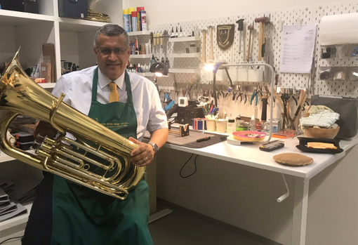 Musical Instrument Repair Ron Moonesinghe a musical instrument repairer in his workshop