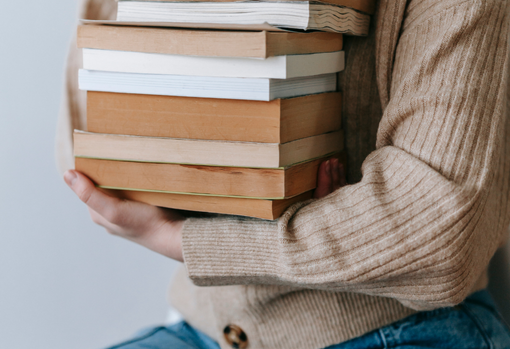 Woman donating a pile of books