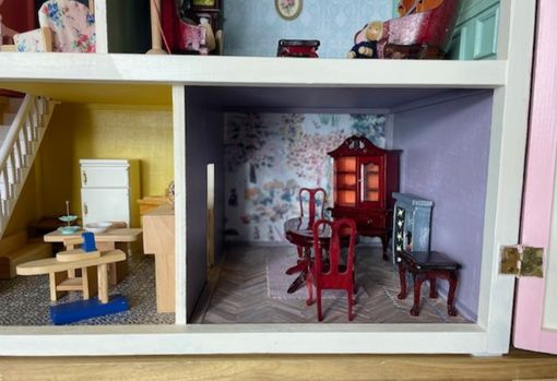 Interiors shots of a restored antique dolls house