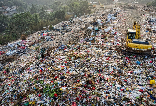 Huge landfill site piled high with discarded items
