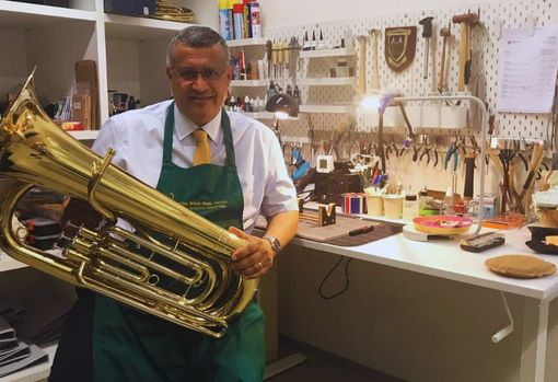 british-music-service02 Ron repairing a musical instrument in his workshop