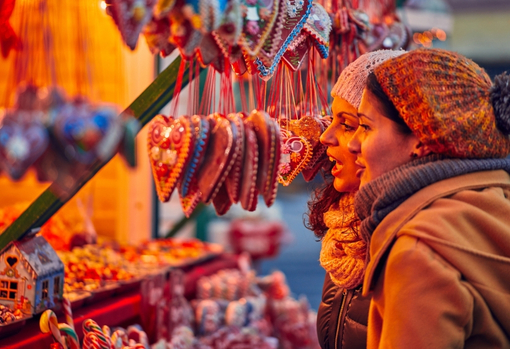 Two customers buying Christmas decorations from a small business