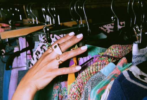 Woman shopping for pre-loved clothes