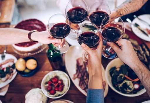Group of people eating Christmas dinner together 