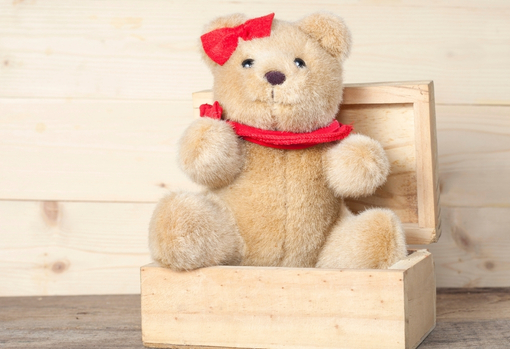 Repaired childhood teddy in a gift box