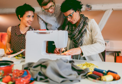group-of-people-sewing Group of people working on sewing repairs