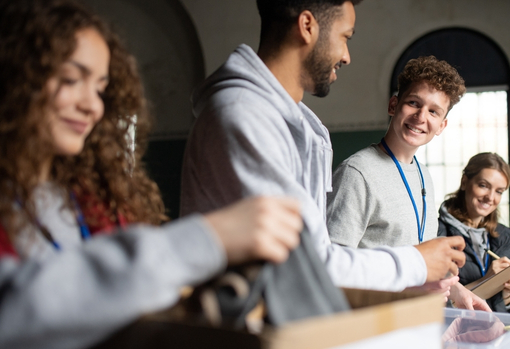repair-cafe-community-working-together Repair cafe group working together on repairs