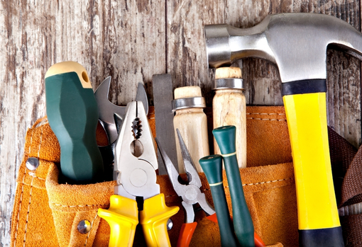 donating-toys-06 Woman and young girl fixing a teddy bear at home
