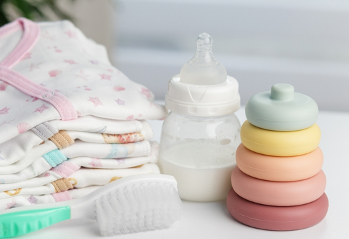 sorting-baby-clothes-04 A pile of baby clothes and toys