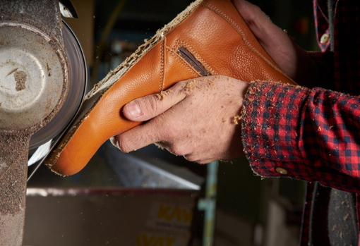 Shoe cobbler fixing sole of shoe