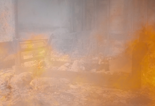 Smoke filled room with burning sofa