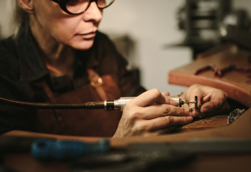 Jewellery repairer fixing a ring
